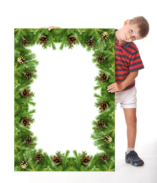 Niño sosteniendo una bandera de Navidad —  Fotos de Stock