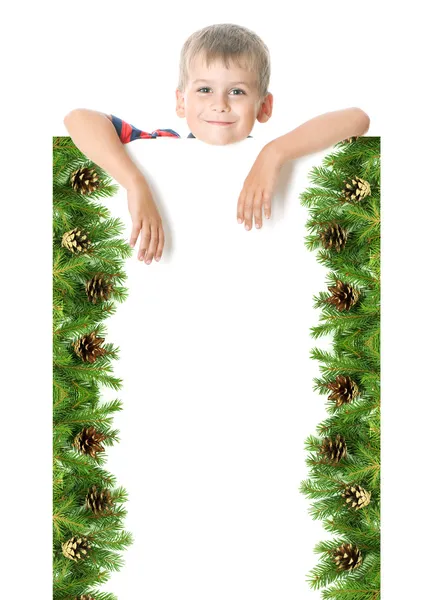 Chłopak trzymając transparent Boże Narodzenie — Zdjęcie stockowe