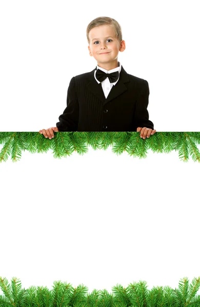 Pojken håller en jul banner — Stockfoto