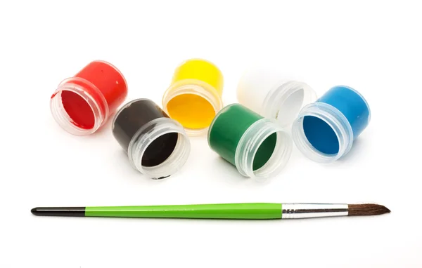 Paints with a paintbrush — Stock Photo, Image
