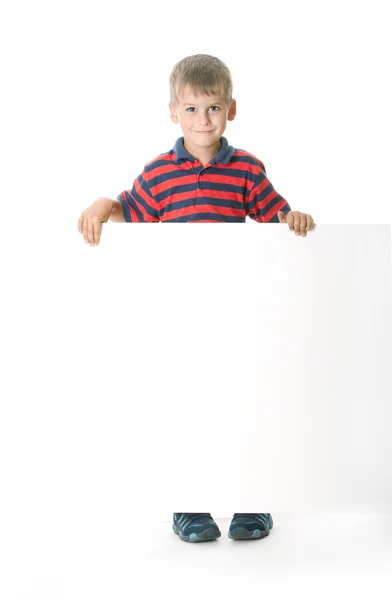 Niño sosteniendo una pancarta — Foto de Stock