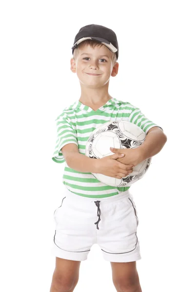 Menino segurando uma bola de futebol — Fotografia de Stock