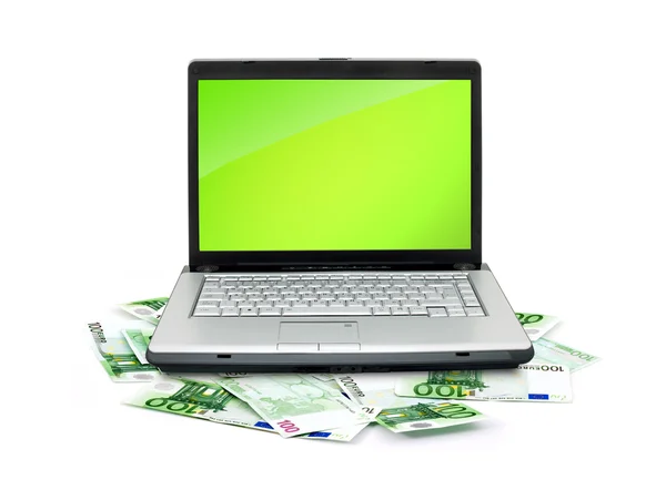 Laptop aberto com dinheiro — Fotografia de Stock