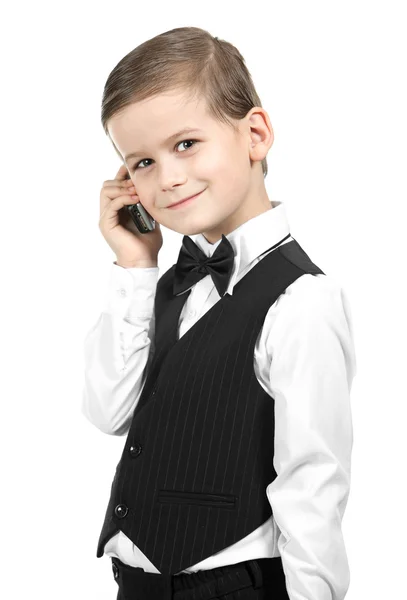 Pojken håller en mobiltelefon — Stockfoto