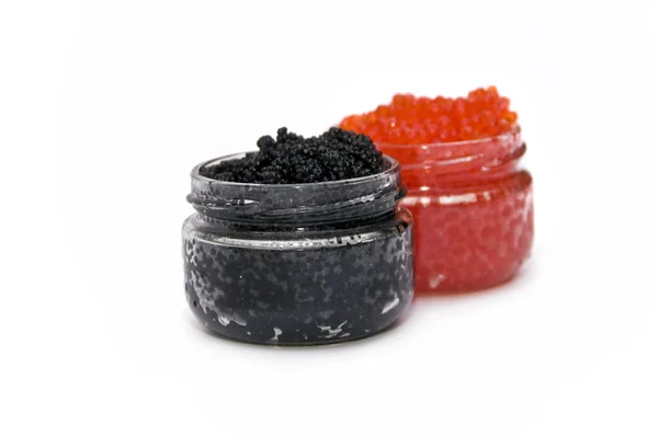 Röd och svart kaviar i ett hjärta Stockfoto