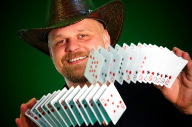 Man skilfully shuffles playing cards clipart