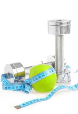 Dumbbells and apple. A healthy way of li clipart