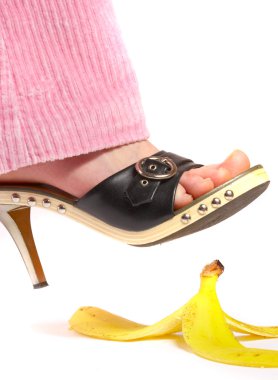 Female leg(foot) and peel of a banana. L clipart