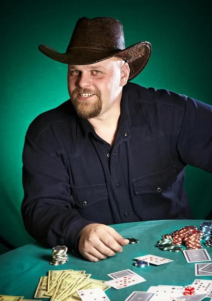 Man with a beard plays poker — Stock Photo, Image