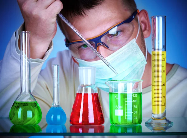 Scientist in laboratory with test tubes Stock Image