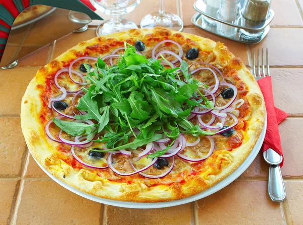 Hot pizza on a table in cafe — Stock Photo, Image