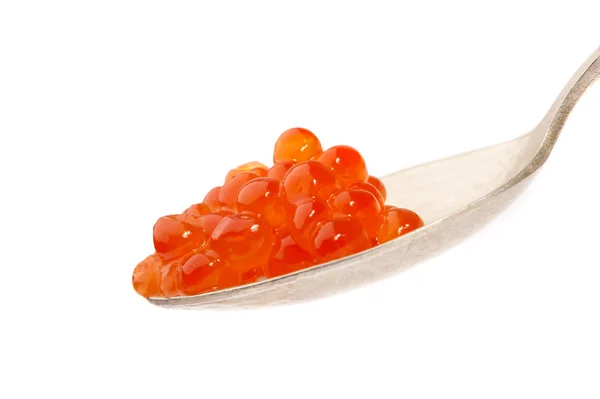 stock image Red caviar on the spoon, on a white back