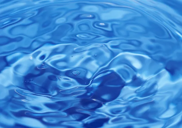 Bakgrund från blå vatten fläckar — Stockfoto
