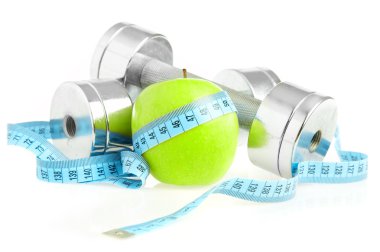 Dumbbells and apple. A healthy way of li