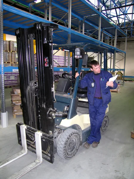 stock image The worker in a trading warehouse.