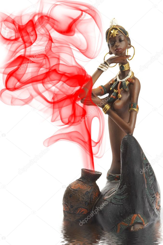 Figurine of the African girl on a white