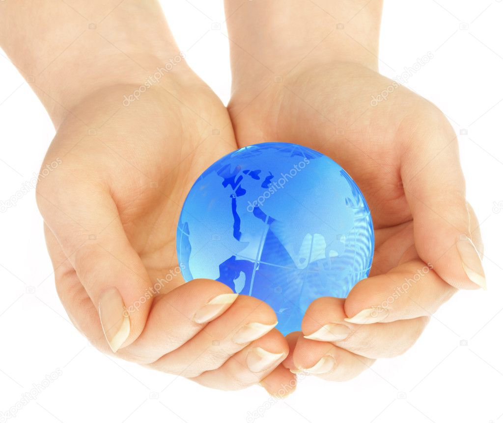The hand of the person holds globe on a