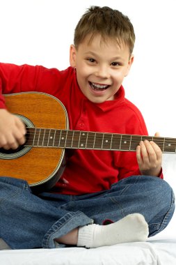 Boy and acoustic guitar clipart