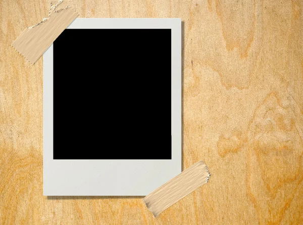 Polaroid on plywood — Stock Photo, Image