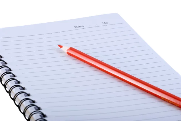 Boş bir not defteri ve kalem kırmızı — Stok fotoğraf