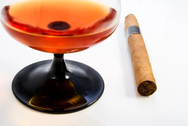 Stock image Snifter with brandy and havana cigar