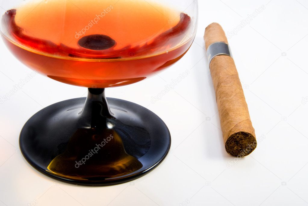 Snifter with brandy and havana cigar