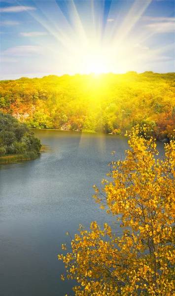 Golden autumn sunbeams above river and m — Stock Photo, Image