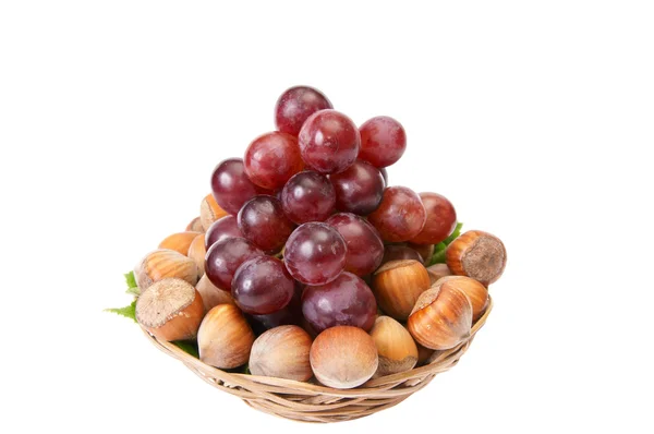 Tasty , ripe hazelnuts and grape isolate — Stock Photo, Image