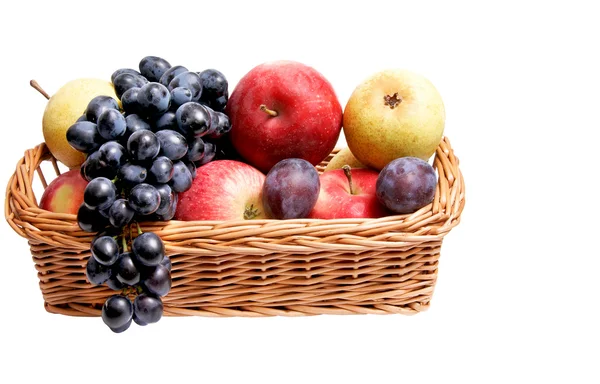 Ripe autumn fruits at the wooden basket. — Stock Photo, Image