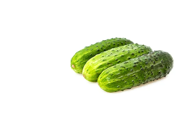 Drie komkommers geïsoleerd op een whitegroun — Stockfoto