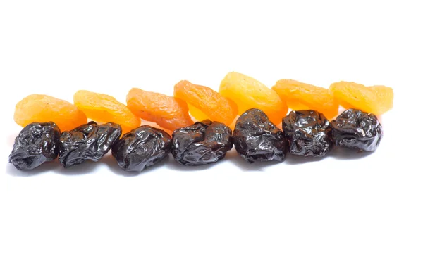 stock image Dried apricot and prune on a white back