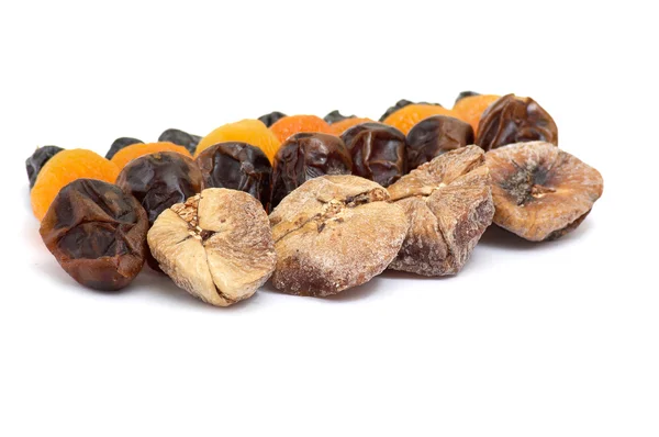 Mixed dried fruits on a white. — Stock Photo, Image