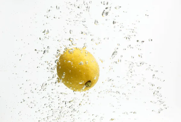 One yellow lemon and water. — Stock Photo, Image