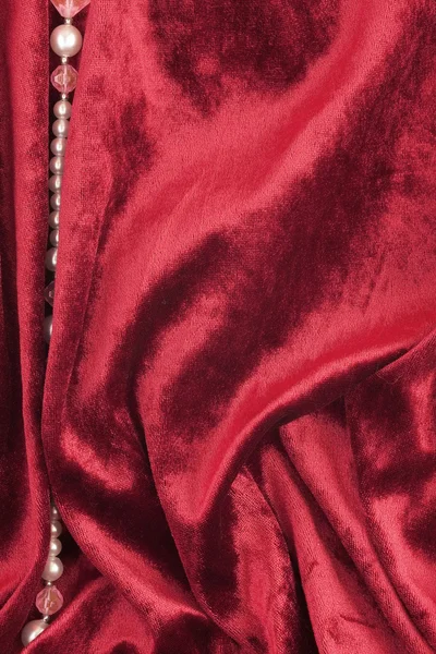 Velluto rosso e perline — Foto Stock