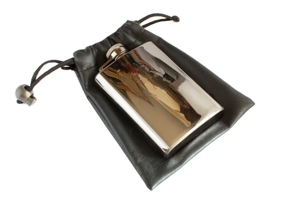 Metallic flask for alcohol on black soft — Stock Photo, Image