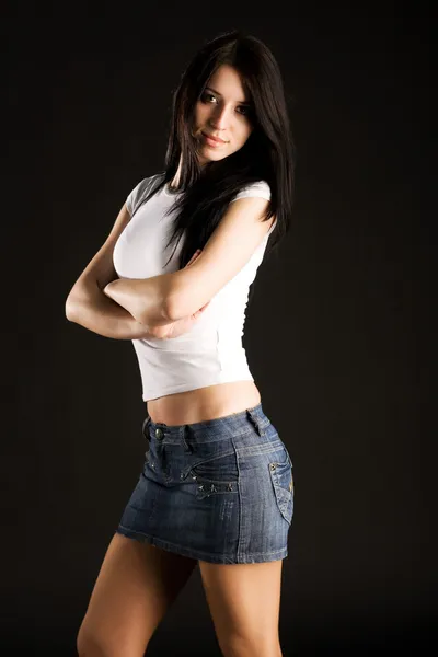 Beautiful young woman in sexy skirt — Stock Photo, Image
