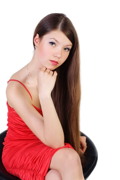 Beautiful young woman on a chair — Stock Photo, Image