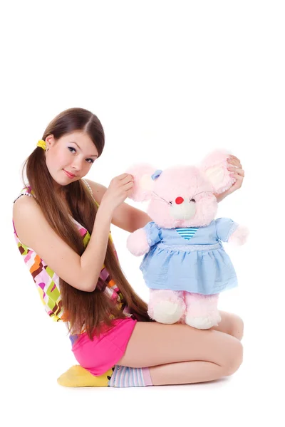 Lovely young girl with a toy — Stock Photo, Image