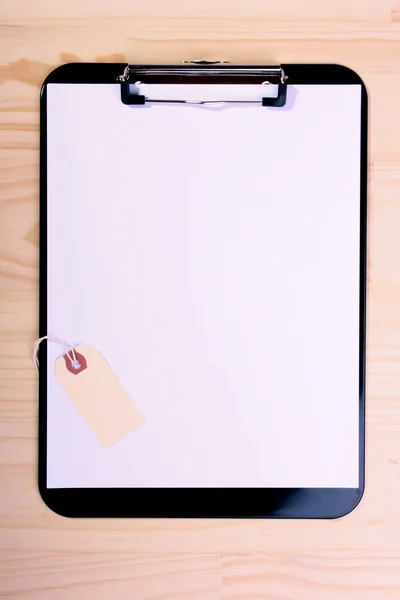 Blank clipboard and label — Stock Photo, Image