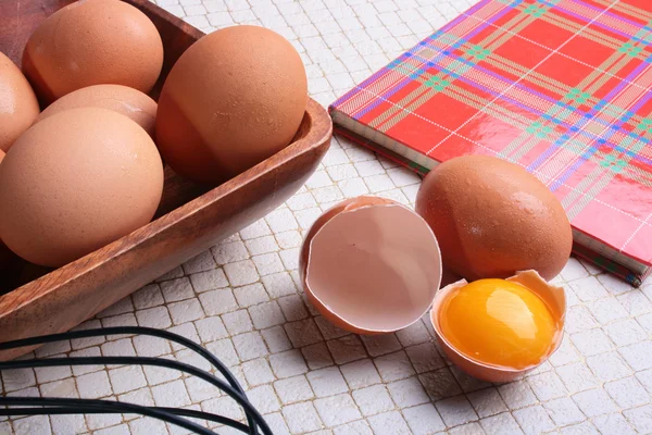 Book for recipes and eggs — Stock Photo, Image