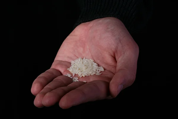 Main avec riz — Photo