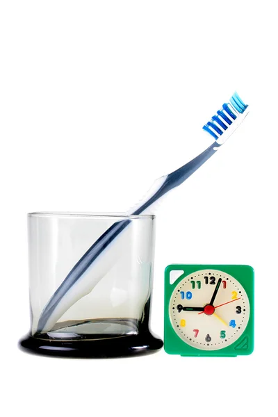 Escova de dentes e relógio — Fotografia de Stock