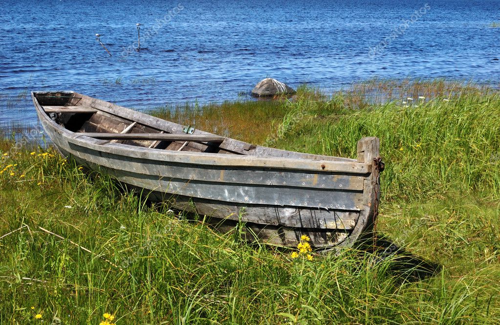 Old wooden boat on the lake bank — Stock Photo © viknik #1206534