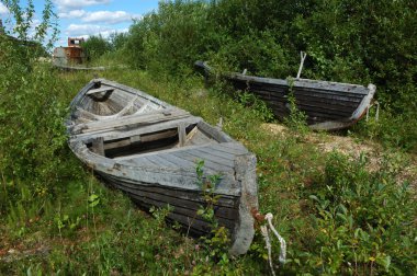 Old wooden boats on the ground clipart