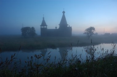 Silhouette of ancient church at sunrise clipart