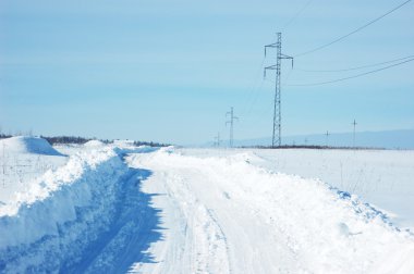 Snow covered winter road clipart