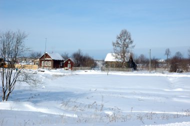 Winter view of small russian village clipart