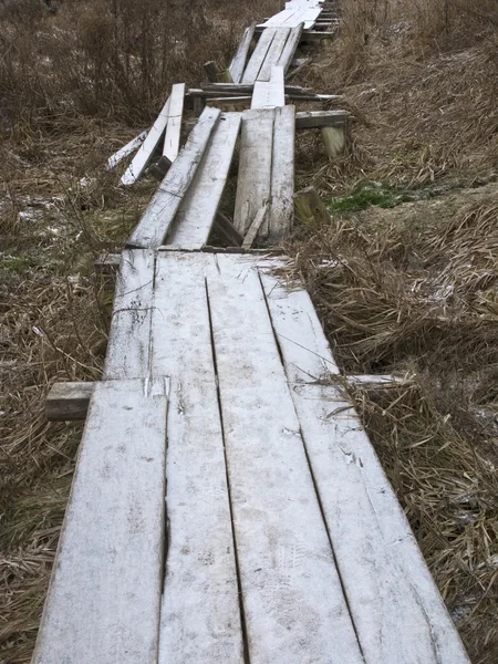 Destroyed wooden footway with hoarfrost — Stock Photo, Image