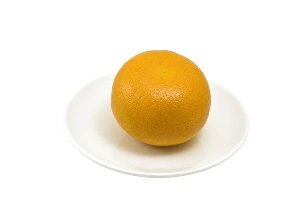 Grapefruit in white plate — Stock Photo, Image