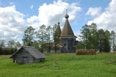 Ancient wooden russian country church clipart